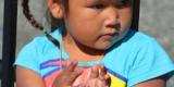 Indigenous little girl clapping